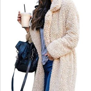 Long faux fur coat in the color light beige